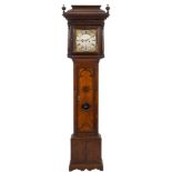 An early oak longcase clock: the eight-day duration movement striking the hours on a bell,