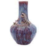 A Chinese flambé-glazed bottle vase: of globular form with raised neck,