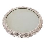 A silver plated table centrepiece: of circular form: the mirror plate enclosed by a vine leaf and