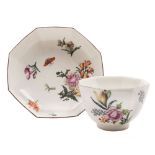 A Chelsea octagonal teabowl and saucer: finely painted with insects, floral sprays and sprigs,