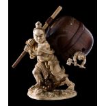 A fine Japanese ivory and boxwood okimono of Nio slaying oni demons: carrying a carved hardwood