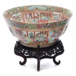 A large Canton famille rose bowl: painted with panels of interior and terrace scenes with officials,