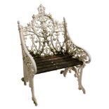 A Victorian cast iron garden armchair:, of Coalbrookdale type,