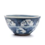 A miniature Chinese porcelain bowl: the exterior painted in blue with two bands containing small