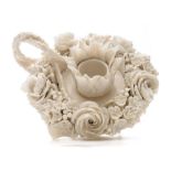 A rare First Period Belleek boudoir candlestick: of florally encrusted form with rustic handle,