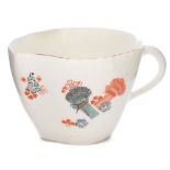 A Chantilly peach-shaped cup: with loop handle,