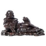 A Chinese carved hard wood figure of a reclining Lin Hai and his three-legged toad: mounted on a