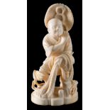 A Japanese carved ivory okimono: of a fisherman standing with his net, in traditional costume,