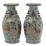 A pair of Canton famille rose baluster vases: with double lion dog handles,