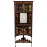 An Art Nouveau mahogany and inlaid standing corner display cabinet:,