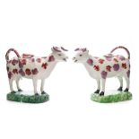 A pair of Welsh pearlware cow creamers: each modelled standing four square and decorated with