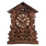 An oak Black Forest cuckoo clock: the eight-day duration,