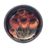 A Moorcroft Tudric pewter mounted bowl: tubelined in the Poppies pattern in red,