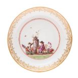 A Meissen saucer: finely painted with a chinoiserie scene in the manner of J.G.