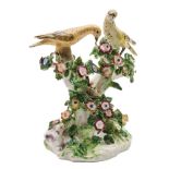 A Bow 'Birds In Branches' candlestick group: modelled as two birds perched on flowering branches,
