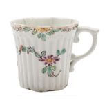 An early Worcester ribbed coffee can: of lobed form with pleated rim and scroll handle,