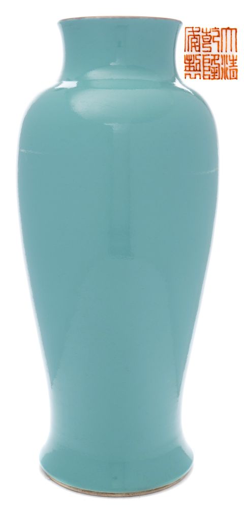 A Chinese porcelain polychrome vase: of slender baluster form under a turquoise glaze,