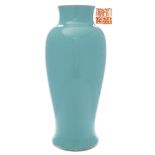 A Chinese porcelain polychrome vase: of slender baluster form under a turquoise glaze,