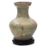 A large Chinese pottery baluster jar: the exterior covered in a mottled pale green glaze and