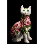 A Wemyss Ware pottery cat: modelled in seated posture and decorated with pink cabbage roses,