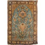 A Qum rug:, the powder blue mihrab with a design of cartouche medallions, birds,