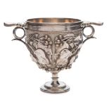 An Elkington plated two handled pedestal goblet: with embossed vine leaf and grape decoration,