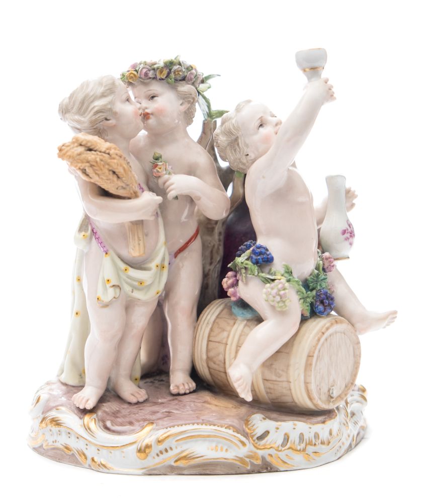 A Meissen porcelain group allegorical of the Seasons: modelled as scantily clad putti,