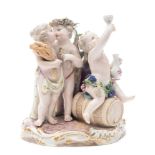 A Meissen porcelain group allegorical of the Seasons: modelled as scantily clad putti,