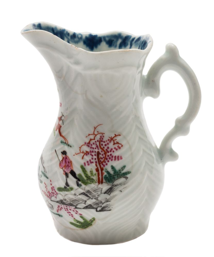A First Period Worcester feather-moulded cream jug: with double scroll handle,