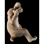 A Japanese carved ivory okimono: modelled as a howler monkey with pine cones, unsigned,