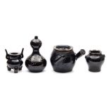 A group of Chinese brown glazed wares: comprising a Ding form censer a baluster vase with mask