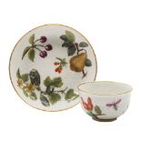 A Chelsea tea bowl and saucer: with pineapple moulding,