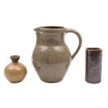 Three pieces of Lowerdown Pottery stoneware: comprising a jug under oatmeal glazes,