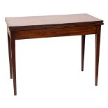 An early 19th Century mahogany and inlaid rectangular tea table:, bordered with boxwood lines,