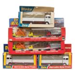 Three Dinky Mercedes Benz Trucks (940) together with two Dinky Convoy Series sets (399):.