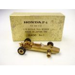 Kado (Japan),a 1/43 scale all brass Honda F-1 RA 273 V-12 racing car:, in original box,