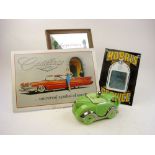 A Sadler Art Deco racing car teapot: in green with silver lustre trim,