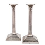 A pair of Victorian silver Corinthian column candlesticks, maker William Hutton & Sons Ltd, London,