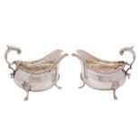 A pair of Elizabeth II silver sauceboats, maker's mark worn possibly LF & Co Ltd, London,