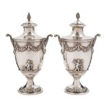 A pair of Edward VII silver urns and covers, maker C S Harris & Sons Ltd,