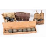 Three sets of Lawn Green bowling woods and a set of boules:.