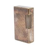 An S J Dupont silver plated lighter:, with ribbed body.