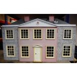 A 20th century doll's house: with double hinged front enclosing hallway, staircase and six rooms,