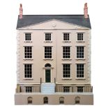 A Georgian style dolls house with double front opening enclosing seventeen rooms:,