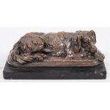 T Hingre, a 19th century patinated bronze of a recumbent dog:, on a cushion base,