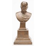 A bronze bust of Field Marshall Sir Douglas Haig: modelled in military uniform on a square socle