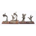 A group of four pewter bird figures:, comprising a Barn Owl and three others of Mallards,