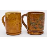 Two Ewenny commemorative pottery mugs: one incised Nantycafan and Brynteg V.E. and V.J.