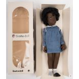 A Sasha 'Doll 'Cora' No 119:, black hair, painted face and vinyl body,