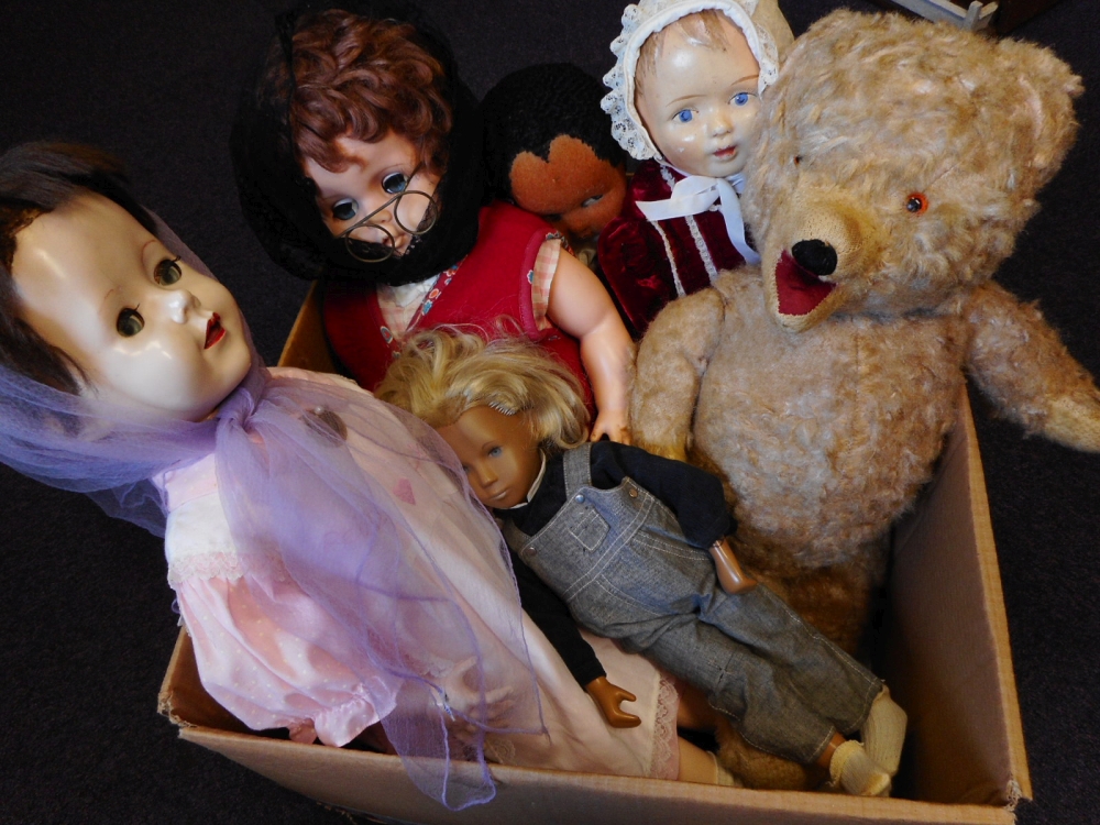 A collection of assorted dolls : including a Sasha girl doll dressed in corduroy blouse and denim